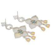 Elegant silver earrings with floral design and gemstone accents, showcasing intricate details and a sophisticated style.